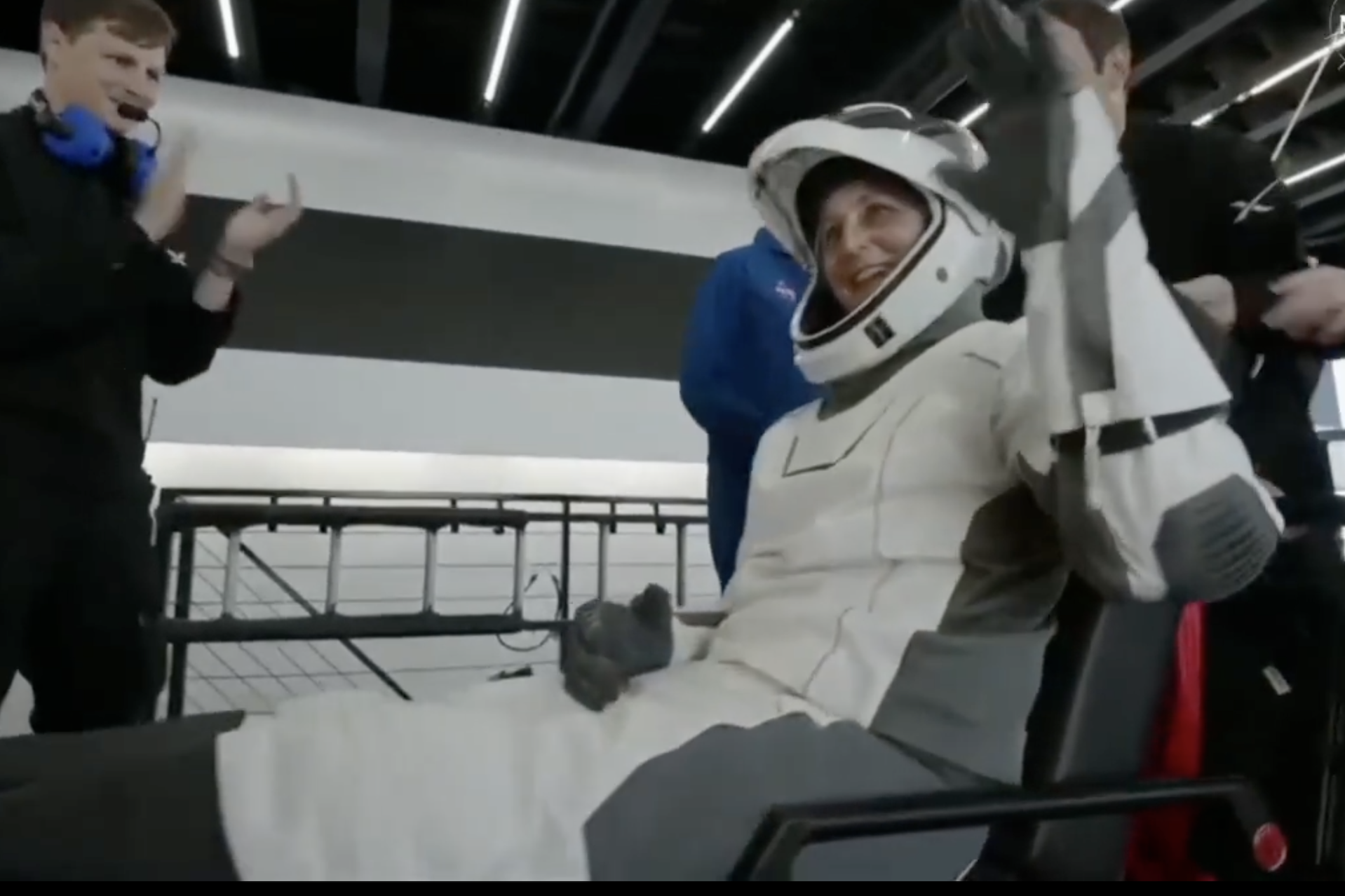 Stranded NASA astronauts touch down, plucked from ocean