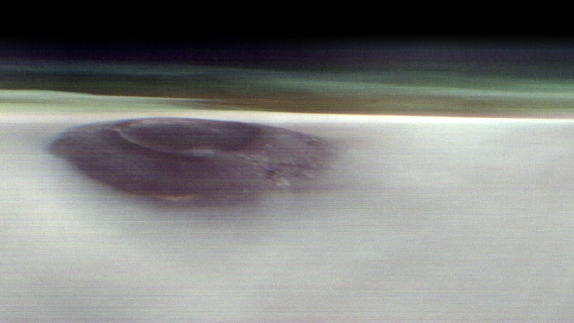 NASA orbiter saw something astonishing peek through Martian clouds